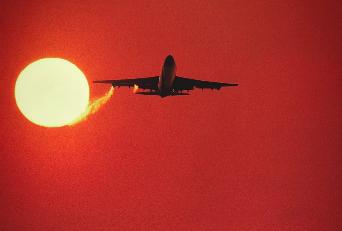 boeing-747-taking-off-at-sunset
